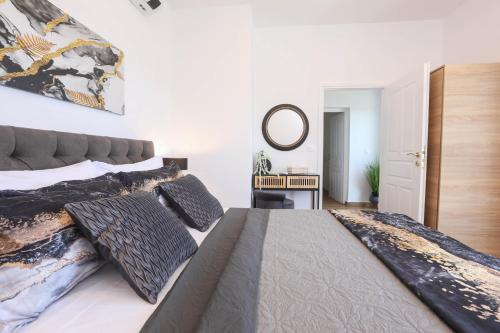Postel nebo postele na pokoji v ubytování Vlachos Maisonette