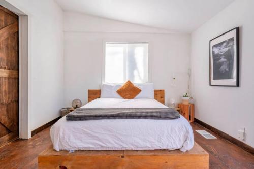 a bedroom with a large bed and a window at Serene Catskills Retreat with Deck in Woodbourne