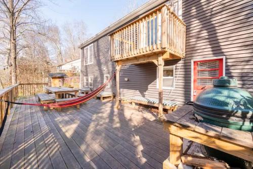 a porch with a hammock and a house at Serene Catskills Retreat with Deck in Woodbourne