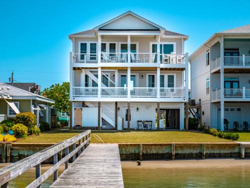 a house on the water with a dock at Channel 6 in Surf City