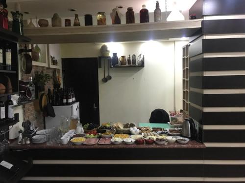 a table with many plates of food on it at Tbiliseli Inn in Tbilisi City