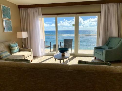 a living room with a view of the ocean at Marriott St Marteen 3 bedroom Villa in Dawn Beach