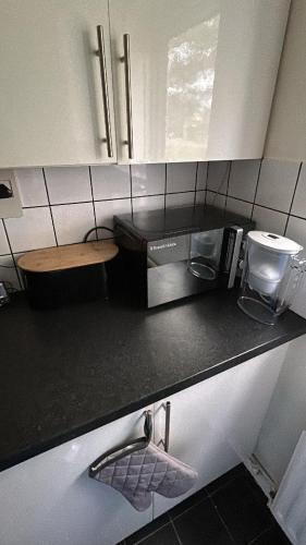 a kitchen with a counter top with a sink at DK House in Colchester