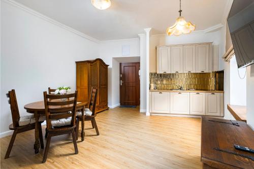 Η κουζίνα ή μικρή κουζίνα στο Apartamenty Magia