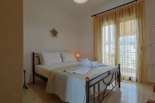 Postel nebo postele na pokoji v ubytování Zeusplace Leptokarya Seaside Apartment