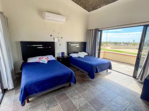 Cama o camas de una habitación en Hostal las Quintas