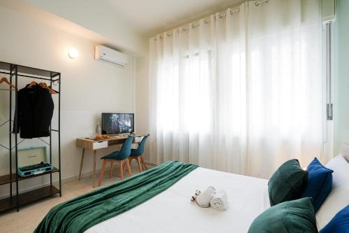 a bedroom with a bed and a desk with a computer at Maison Turin in Turin