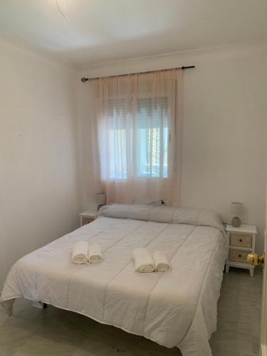 Ένα ή περισσότερα κρεβάτια σε δωμάτιο στο Apartamento Aries
