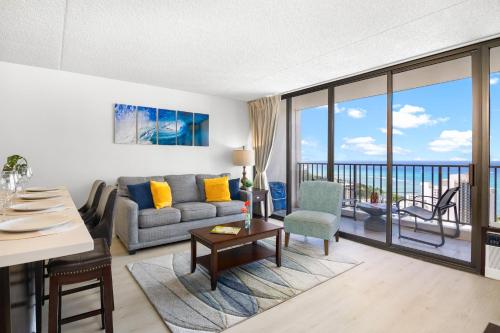 a living room with a view of the ocean at Breathtaking Ocean View 1 BR Condo with Free Parking! in Honolulu