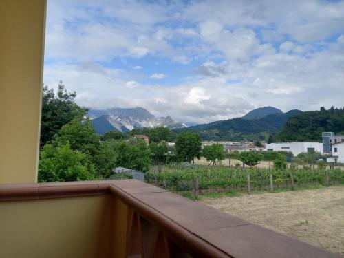 a balcony with a view of the mountains at Vecchio Portale in Carrara