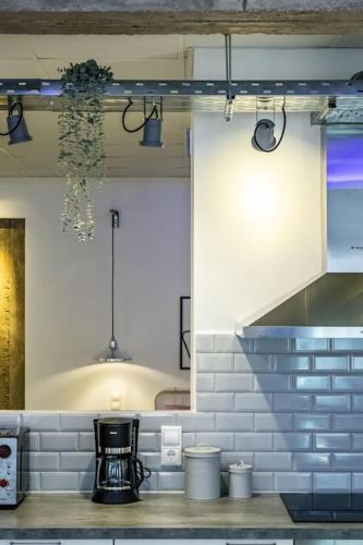 a room with a kitchen with a sink at Fouxia-Grey in Skopelos Town