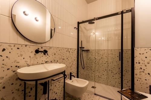 a bathroom with a sink and a shower at Residenza San Longino in Mantova