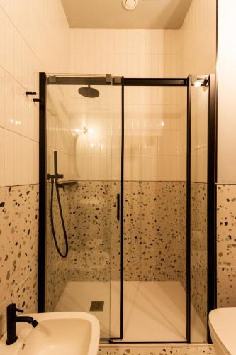 a bathroom with a shower and a sink at Residenza San Longino in Mantova