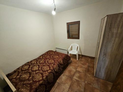 Ένα ή περισσότερα κρεβάτια σε δωμάτιο στο Alpe House Korita