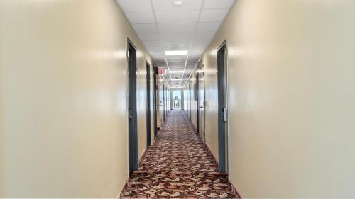 a hallway of an office building with a carpeted corridor at Safari Hotel Boardwalk in Ocean City