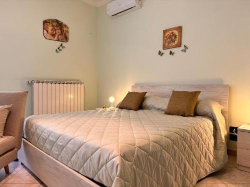a bedroom with a large bed in a room at Bed & Breakfast da Giovanni in Alessano
