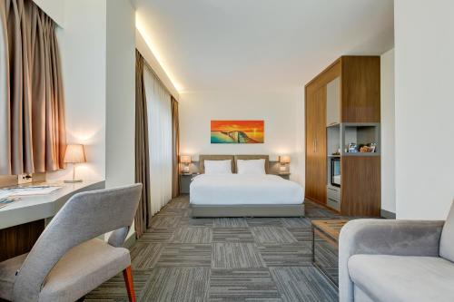 Ένα ή περισσότερα κρεβάτια σε δωμάτιο στο Plus Hotel Bostanci Atasehir