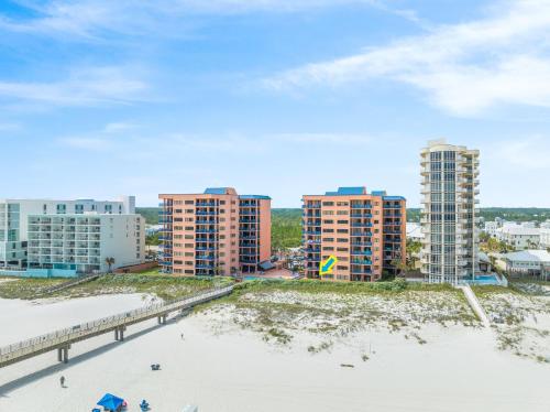 an aerial view of the beach and buildings at Four Seasons 103E by Vacation Homes Collection in Orange Beach