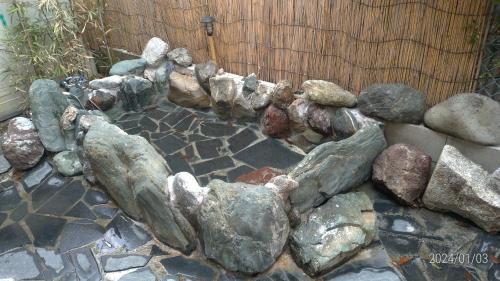 a bunch of rocks in a rock garden at Tadoan - Vacation STAY 16923 in Nagashima