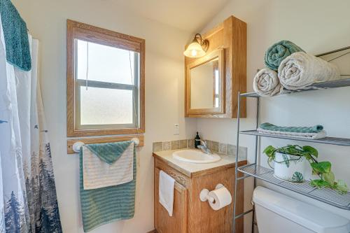 a bathroom with a sink and a toilet and a window at Hiking Trail On-Site Mtn-View Eagle Point Retreat in Eagle Point