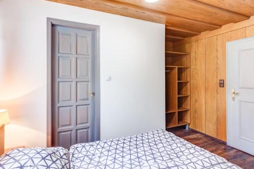a bedroom with a bed and a closet at Ludwighaus in Neukirchen am Großvenediger