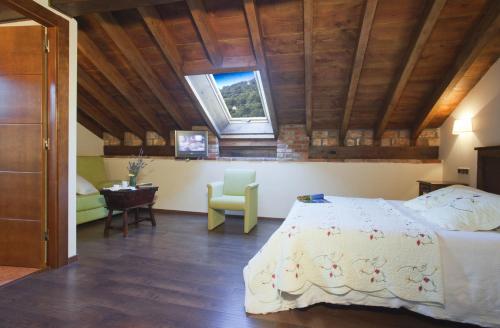 Postel nebo postele na pokoji v ubytování Hotel Rural El Fundil