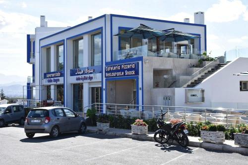 a car parked in a parking lot in front of a building at studio en Résidence mirador golf in Tetouan