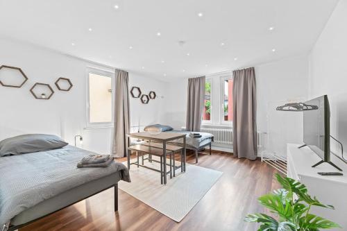 Postel nebo postele na pokoji v ubytování ES02 schönes Apartment für Teams - 2 Schlafzimmer, 4 Einzelbetten, Nähe Messe
