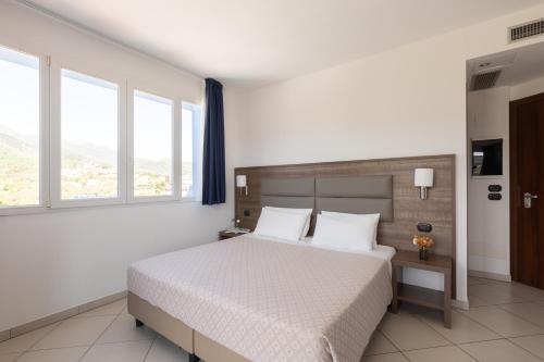 Ai Pozzi Village Resort & SPAにあるベッド