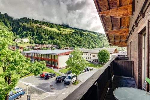 a balcony with cars parked in a parking lot at Ludwighaus in Neukirchen am Großvenediger