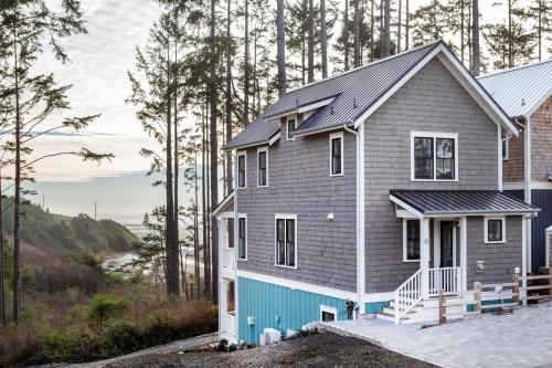 a house with a blue and grey at A Wave from It All by Seabrook Hospitality in Pacific Beach