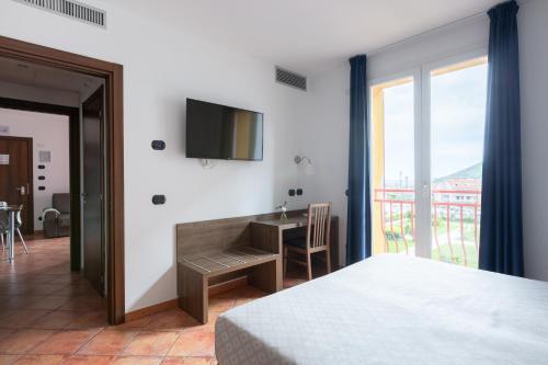 Ai Pozzi Village Resort & SPAにあるベッド