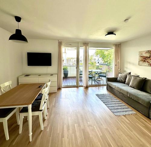 a living room with a couch and a table at Vienna Sunny Side Up Apartments in Vienna