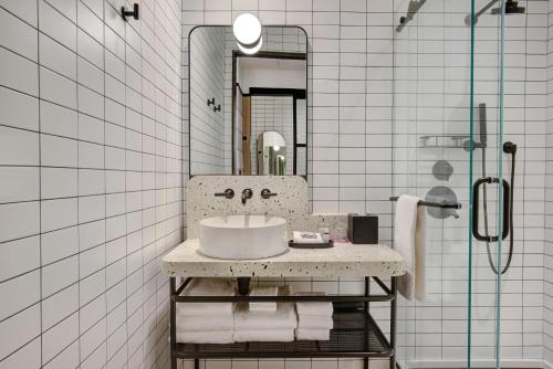 a bathroom with a sink and a mirror at Moxy Banff in Banff
