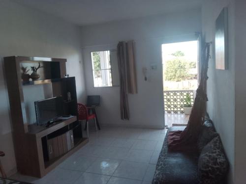 TV a/nebo společenská místnost v ubytování Ap07-A 50 Metros da Praia Flats Mobiliados para 4 pessoas