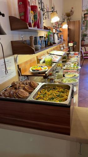 a buffet line with many different types of food at IMBACHHORN Pension in den Alpen in Fusch an der Glocknerstraße
