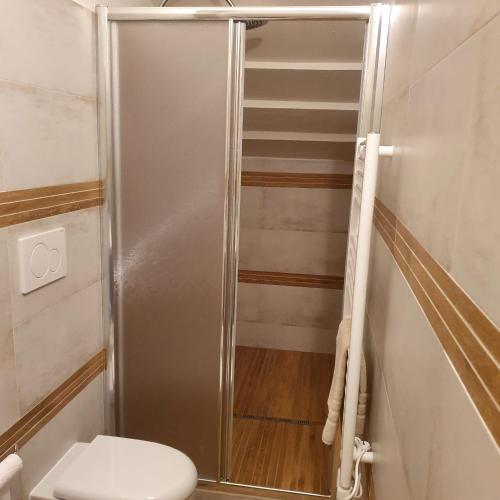 a shower stall in a bathroom with a toilet at Mojito's house in Rio Marina