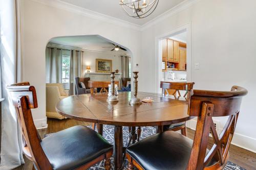 a kitchen and dining room with a wooden table and chairs at Minneapolis Vacation Rental about 5 Mi to Downtown! in Minneapolis