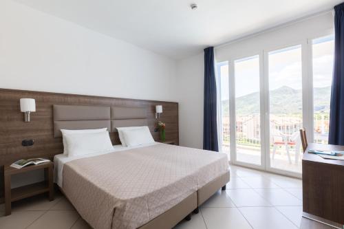 Ai Pozzi Village Resort & SPAにあるベッド