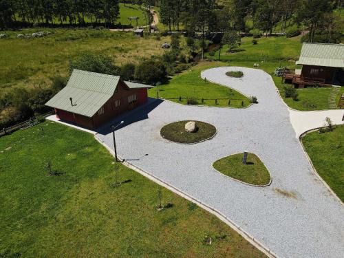 an overhead view of a building with a path next to a field at Vila Vert - Rancho Queimado - SC in Rancho Queimado