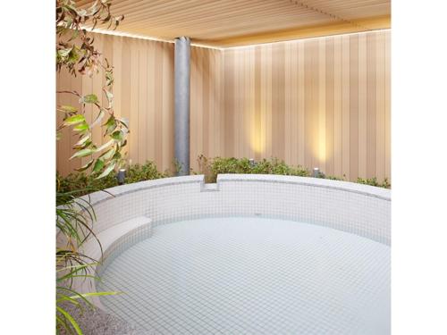 a swimming pool in a backyard with a fence at Osaka Academia - Vacation STAY 78649v in Osaka