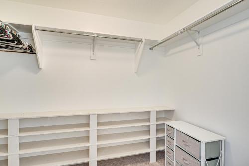 a closet with white shelves and a desk at American Fork Home about 8 Mi to Thanksgiving Point! in American Fork