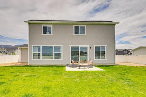 a house with a table and chairs in a yard at American Fork Home about 8 Mi to Thanksgiving Point! in American Fork