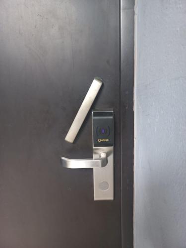 a piece of paper sticking out of a door at Invernadero Inn in Veracruz