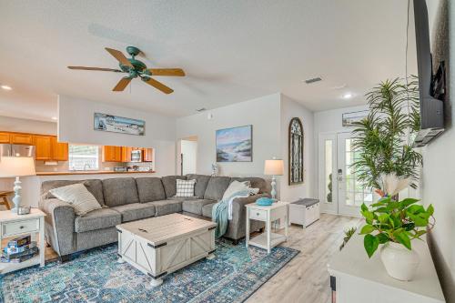 a living room with a couch and a table at 4 Mi to Rainbow Springs Dunnellon Home with Pool! in Dunnellon