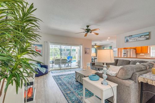 a living room with a couch and a table at 4 Mi to Rainbow Springs Dunnellon Home with Pool! in Dunnellon