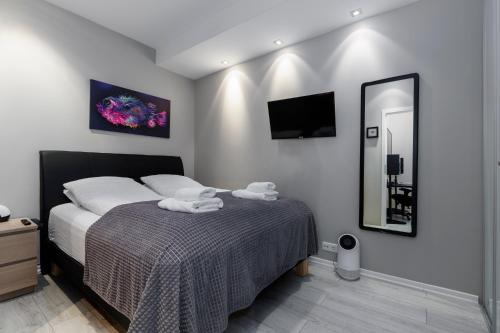 a bedroom with a bed with towels on it at Apartment in Downtown Reykjavík in Reykjavík