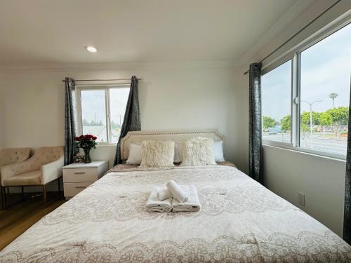 a bedroom with a large bed and a window at Contemporary Private Room 7 in Los Angeles