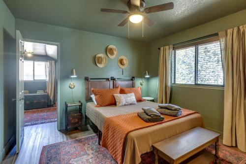 a bedroom with a bed and a ceiling fan at Pet-Friendly Escape with Game Room and Fire Pit! in North Fork