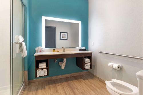 a bathroom with a sink and a mirror at Best Western Plus Medical Center in Amarillo